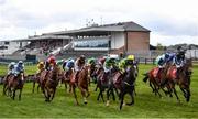 27 April 2021; Runners and riders race past the empty grandstand during the Have The Conversation Say Yes To Organ Donation Novice Handicap Hurdle during day one of the Punchestown Festival at Punchestown Racecourse in Kildare. Photo by David Fitzgerald/Sportsfile