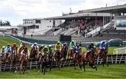 27 April 2021; Runners and riders jump the second fence in front of an empty grandstand during the Have The Conversation Say Yes To Organ Donation Novice Handicap Hurdle during day one of the Punchestown Festival at Punchestown Racecourse in Kildare. Photo by David Fitzgerald/Sportsfile