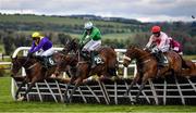 27 April 2021; Jazzaway, with Conor McNamara up, centre, jumps the last alongside eventual second place Whiskey Sour, with Hugh Morgan up, left, and Arcadian Sunrise, with Denis O'Regan, right, on their way to winning the Killashee Hotel Handicap Hurdle during day one of the Punchestown Festival at Punchestown Racecourse in Kildare. Photo by David Fitzgerald/Sportsfile