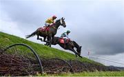 27 April 2021; Singing Banjo, with Barry John Walsh, left, clear Rubys Double alongside Vital Island, with Jamie Codd up, on their way to winning way to winning the Kildare Hunt Club Fr Sean Breen Memorial Steeplechase during day one of the Punchestown Festival at Punchestown Racecourse in Kildare. Photo by David Fitzgerald/Sportsfile