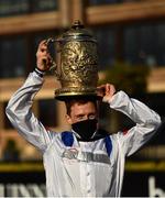 28 April 2021; Jockey Sam Twiston-Davies celebrates with the trophy after riding Clan Des Obeaux to victory the Ladbrokes Punchestown Gold Cup during day two of the Punchestown Festival at Punchestown Racecourse in Kildare. Photo by David Fitzgerald/Sportsfile