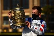 28 April 2021; Jockey Sam Twiston-Davies celebrates with the trophy after riding Clan Des Obeaux to victory the Ladbrokes Punchestown Gold Cup during day two of the Punchestown Festival at Punchestown Racecourse in Kildare. Photo by David Fitzgerald/Sportsfile