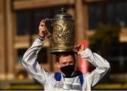 28 April 2021; Jockey Sam Twiston-Davies celebrates with the trophy after riding Clan Des Obeaux to victory the Ladbrokes Punchestown Gold Cup during day two of the Punchestown Festival at Punchestown Racecourse in Kildare. Photo by David Fitzgerald/Sportsfile