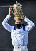 28 April 2021; Jockey Sam Twiston-Davies celebrates with the trophy after riding Clan Des Obeaux to victory the Ladbrokes Punchestown Gold Cup during day two of the Punchestown Festival at Punchestown Racecourse in Kildare. Photo by David Fitzgerald/Sportsfile