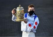 28 April 2021; Jockey Sam Twiston-Davies celebrates with the trophy after riding Clan Des Obeaux to victory the Ladbrokes Punchestown Gold Cup during day two of the Punchestown Festival at Punchestown Racecourse in Kildare. Photo by David Fitzgerald/Sportsfile