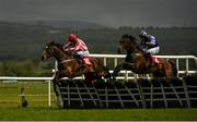 29 April 2021; Jiving Jerry, with Cathal Landers up, left, jumps the last alongside eventual second place Flindt, with Aaron Murphy up, on their way to winning the Specialist Joinery Group Handicap Hurdle during day three of the Punchestown Festival at Punchestown Racecourse in Kildare. Photo by Harry Murphy/Sportsfile