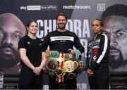 29 April 2021; Katie Taylor and Natasha Jonas square off, in the company of promoter Eddie Hearn, during a press conference at the Matchroom Boxing fight hotel in Manchester, England, ahead of their WBC, WBA, IBF and WBO female lightweight title fight on Saturday Night. Photo by Mark Robinson / Matchroom Boxing via Sportsfile