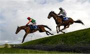 29 April 2021; Classic Concorde, left, with JJ Slevin up, and Call It Magic, with Keith Donoghue up, jump Ruby's Double during the Mongey Communications La Touche Cup Cross Country Steeplechase on day three of the Punchestown Festival at Punchestown Racecourse in Kildare. Photo by Harry Murphy/Sportsfile