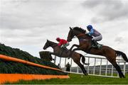 30 April 2021; Beyond Redemption, with Jamie Codd up, left, and Enniskillen, with Brendan Walsh up, jump the third during the Paddy Power Hunters Steeplechase during day four of the Punchestown Festival at Punchestown Racecourse in Kildare. Photo by Harry Murphy/Sportsfile