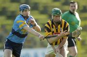 7 February 2004; Jimmy Coogan, Kilkenny, in action against UCD's Stephen Lucey. Walsh Cup Senior Hurling Final 2004, Kilkenny v UCD, Nowlan Park, Co. Kilkenny. Picture credit; Damien Eagers / SPORTSFILE *EDI*