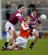 8 February 2004; Galway's Padraig Joyce, left, and Matthew Clancy, combine to tackle Armagh's John Paul Donnelly. Allianz National Football League, Division 1B, Galway v Armagh, Pearse Stadium, Galway. Picture credit; Ray McManus / SPORTSFILE *EDI*