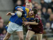 8 February 2004; Shane Carroll, Longford, in action against Westmeath's James Conroy. Allianz National Football League, Division 1A, Westmeath v Longford, Cusack Park, Mullingar, Co. Westmeath. Picture credit; Damien Eagers / SPORTSFILE *EDI*