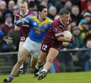 8 February 2004; Alan Mangan, Westmeath, in action against Longford's Enda Ledwith. Allianz National Football League, Division 1A, Westmeath v Longford, Cusack Park, Mullingar, Co. Westmeath. Picture credit; Damien Eagers / SPORTSFILE *EDI*