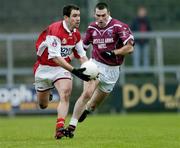 4 January 2004; Peter McGinnity, Louth, in action against Michael Ennis, Westmeath. O'Byrne Cup, Westmeath v Louth, Cusack Park, Mullingar, Co. Westmeath. Picture credit; Ray McManus / SPORTSFILE *EDI*
