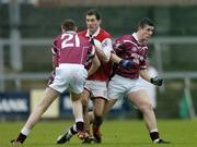 4 January 2004; David Devenney, Louth, in action against Westmeath's Fergal Dardis (21) and Gary Dolan. O'Byrne Cup, Westmeath v Louth, Cusack Park, Mullingar, Co. Westmeath. Picture credit; Ray McManus / SPORTSFILE *EDI*