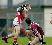 4 January 2004; David Brennan, Louth, in action against Aidan Canning, Westmeath. O'Byrne Cup, Westmeath v Louth, Cusack Park, Mullingar, Co. Westmeath. Picture credit; Ray McManus / SPORTSFILE *EDI*