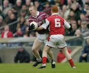 4 January 2004; James Conroy, Westmeath, in action against Andrew Rogan, Louth. O'Byrne Cup, Westmeath v Louth, Cusack Park, Mullingar, Co. Westmeath. Picture credit; Ray McManus / SPORTSFILE *EDI*