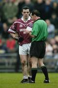 4 January 2004; Referee David Coldrick takes the name of Fergal Murray, Westmeath. O'Byrne Cup, Westmeath v Louth, Cusack Park, Mullingar, Co. Westmeath. Picture credit; Ray McManus / SPORTSFILE *EDI*