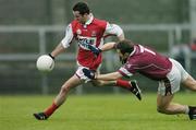 4 January 2004; Alan McCarthy, Louth, in action against Derek Heavin, Westmeath. O'Byrne Cup, Westmeath v Louth, Cusack Park, Mullingar, Co. Westmeath. Picture credit; Ray McManus / SPORTSFILE *EDI*