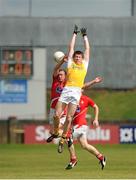29 June 2013; John Carron, Antrim, in action against Ray Finnegan, Louth. GAA Football All-Ireland Senior Championship, Round 1, Louth v Antrim, County Grounds, Drogheda, Co. Louth. Picture credit: Dáire Brennan / SPORTSFILE