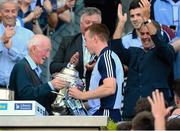 7 July 2013; Former Dublin goalkeeper and Leinster championship winner in 1961 Jimmy Gray, presents the Bob O'Keeffe cup to Dublin captain John McCaffrey. Leinster GAA Hurling Senior Championship Final, Galway v Dublin, Croke Park, Dublin. Picture credit: Ray McManus / SPORTSFILE