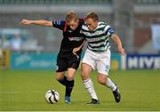 12 July 2013; Simon Madden, Derry City, in action against Stephen Rice, Shamrock Rovers. Airtricity League Premier Division, Shamrock Rovers v Derry City, Tallaght Stadium, Tallaght, Co. Dublin. Picture credit: Barry Cregg / SPORTSFILE