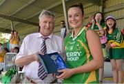 13 July 2013; Louise Galvin, Kerry, is presented with the Player of the Match award by Enda McDonnell, president of the Munster Ladies Gaelic Football Association, after victory over Cork. TG4 Ladies Football Munster Senior Championship Final, Kerry v Cork, Castletownroche, Cork. Picture credit: Diarmuid Greene / SPORTSFILE