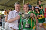 13 July 2013; Kerry captain Bernie Breen is presented with the cup by Enda McDonnell, president of the Munster Ladies Gaelic Football Association, after victory over Cork. TG4 Ladies Football Munster Senior Championship Final, Kerry v Cork, Castletownroche, Cork. Picture credit: Diarmuid Greene / SPORTSFILE