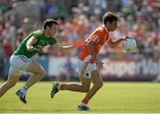 13 July 2013; Jamie Clarke, Armagh, in action against Gary Reynolds,  Leitrim. GAA Football All-Ireland Senior Championship, Round 2, Leitrim v Armagh, Pairc Sean Mac Diarmada, Carrick-on-Shannon, Co. Leitrim. Picture credit: Oliver McVeigh / SPORTSFILE
