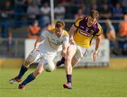 13 July 2013; Sean McCormack, Longford, in action against Rory Quinlivan, Wexford. GAA Football All-Ireland Senior Championship, Round 2, Longford v Wexford, Glennon Brothers Pearse Park, Longford. Picture credit: Matt Browne / SPORTSFILE