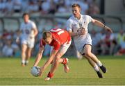 13 July 2013; Ciarann Byrne, Louth, in action against Morgan O'Flaherty, Kildare. GAA Football All-Ireland Senior Championship, Round 2, Kildare v Louth, St Conleth's Park, Newbridge, Co. Kildare. Picture credit: Barry Cregg / SPORTSFILE