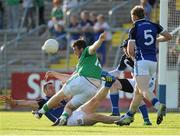 13 July 2013; Seán Quigley, Fermanagh, manages to score a point despite the challenge from Cavan players, left to right, Alan Clarke, Conor Gilsenan and James McEnroe. GAA Football All-Ireland Senior Championship, Round 2, Cavan v Fermanagh, Kingspan Breffni Park, Cavan. Picture credit: Dáire Brennan / SPORTSFILE