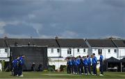 1 May 2021; Players from both sides observe a minute's silence in honour of long-term Pembroke cricket club member Cyril Irwin before the Inter-Provincial Cup 2021 match between Leinster Lightning and North West Warriors at Pembroke Cricket Club in Dublin. Photo by Brendan Moran/Sportsfile