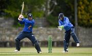 1 May 2021; Graham Hume of North West Warriors playes a shot past Leinster Lightning wicketkeeper Lorcan Tucker during the Inter-Provincial Cup 2021 match between Leinster Lightning and North West Warriors at Pembroke Cricket Club in Dublin. Photo by Brendan Moran/Sportsfile