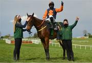 1 May 2021; Jockey Sean Flanagan celebrates with grooms Emma Murray, left, and Emma Connolly and Jeff Kidder after winning the Ballymore Champion Four Year Old Hurdle during day five of the Punchestown Festival at Punchestown Racecourse in Kildare. Photo by Seb Daly/Sportsfile