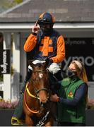 1 May 2021; Jockey Sean Flanagan and Jeff Kidder are led into the winners enclosure by groom Emma Murray after winning the Ballymore Champion Four Year Old Hurdle during day five of the Punchestown Festival at Punchestown Racecourse in Kildare. Photo by Seb Daly/Sportsfile