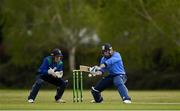 1 May 2021; Jamie Grassi of Leinster Lightning plays a shot watched by North West Warriors wicketkeeper Stephen Doheny during the Inter-Provincial Cup 2021 match between Leinster Lightning and North West Warriors at Pembroke Cricket Club in Dublin. Photo by Brendan Moran/Sportsfile
