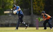 2 May 2021; Rebecca Stokell of Typhoons plays a shot, watched by Scorchers wicketkeeper Shauna Kavanagh, during the Arachas Super 50 Cup 2021 match between Typhoons and Scorchers at Pembroke Cricket Club in Dublin. Photo by Seb Daly/Sportsfile