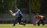 2 May 2021; Rebecca Stokell of Typhoons plays a shot to score a boundary, watched by Scorchers wicketkeeper Shauna Kavanagh, during the Arachas Super 50 Cup 2021 match between Typhoons and Scorchers at Pembroke Cricket Club in Dublin. Photo by Seb Daly/Sportsfile