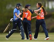 2 May 2021; Lara Maritz of Scorchers, right, is congratulated by teammate Ashlee King after claiming the wicket of Typhoons' Rebecca Stokell during the Arachas Super 50 Cup 2021 match between Typhoons and Scorchers at Pembroke Cricket Club in Dublin. Photo by Seb Daly/Sportsfile