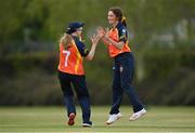 2 May 2021; Lara Maritz of Scorchers, right, is congratulated by teammate Ashlee King after claiming the wicket of Typhoons' Sarah Forbes during the Arachas Super 50 Cup 2021 match between Typhoons and Scorchers at Pembroke Cricket Club in Dublin. Photo by Seb Daly/Sportsfile
