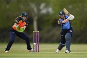 2 May 2021; Louise Little of Typhoons plays a shot, watched by Scorchers wicketkeeper Shauna Kavanagh, during the Arachas Super 50 Cup 2021 match between Typhoons and Scorchers at Pembroke Cricket Club in Dublin. Photo by Seb Daly/Sportsfile