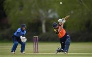 2 May 2021; Gaby Lewis of Scorchers plays a shot to score a boundary, watched by Typhoons wicketkeeper Amy Hunter, during the Arachas Super 50 Cup 2021 match between Typhoons and Scorchers at Pembroke Cricket Club in Dublin. Photo by Seb Daly/Sportsfile