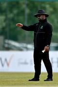 2 May 2021; Umpire Azam Ali Baig signals a boundary during the Arachas Super 50 Cup 2021 match between Typhoons and Scorchers at Pembroke Cricket Club in Dublin. Photo by Seb Daly/Sportsfile