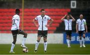 3 May 2021; Junior Ogedi-Uzokwe, left, and Patrick McEleney of Dundalk after conceding their side's second goal during the SSE Airtricity League Premier Division match between Longford Town and Dundalk at Bishopsgate in Longford. Photo by Ramsey Cardy/Sportsfile