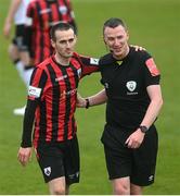3 May 2021; Referee Damien MacGraith shares a joke with Shane Elworthy of Longford Town during the SSE Airtricity League Premier Division match between Longford Town and Dundalk at Bishopsgate in Longford. Photo by Ramsey Cardy/Sportsfile