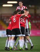 3 May 2021; Derry City players celebrate their first goal, scored by James Akintunde, hidden, during the SSE Airtricity League Premier Division match between Derry City and Finn Harps at Ryan McBride Brandywell Stadium in Derry. Photo by Stephen McCarthy/Sportsfile