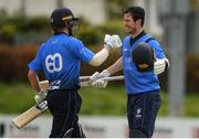 4 May 2021; George Dockrell of Leinster Lightning, right, is congratulated after scoring a 100 by team-mate Barry McCarthy during the Inter-Provincial Cup 2021 match between Leinster Lightning and Northern Knights at Pembroke Cricket Club in Dublin.  Photo by Matt Browne/Sportsfile