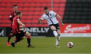 3 May 2021; Patrick McEleney of Dundalk in action against Dean Zambra of Longford Town during the SSE Airtricity League Premier Division match between Longford Town and Dundalk at Bishopsgate in Longford. Photo by Ramsey Cardy/Sportsfile