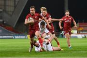 7 May 2021; JJ Hanrahan of Munster beats the tackle of Ulster's Stuart McCloskey on his way to scoring his side's fifth try during the Guinness PRO14 Rainbow Cup match between Munster and Ulster at Thomond Park in Limerick. Photo by Ramsey Cardy/Sportsfile